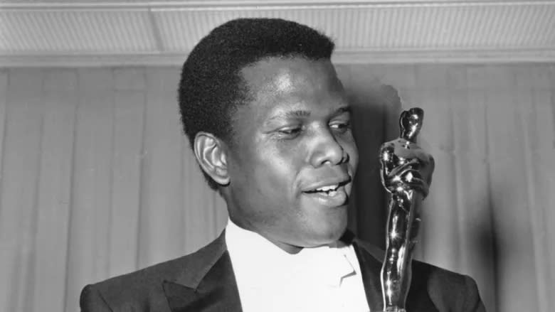 Sidney Poitier with his Oscar in 1964 - Credit: Motion Picture Academy