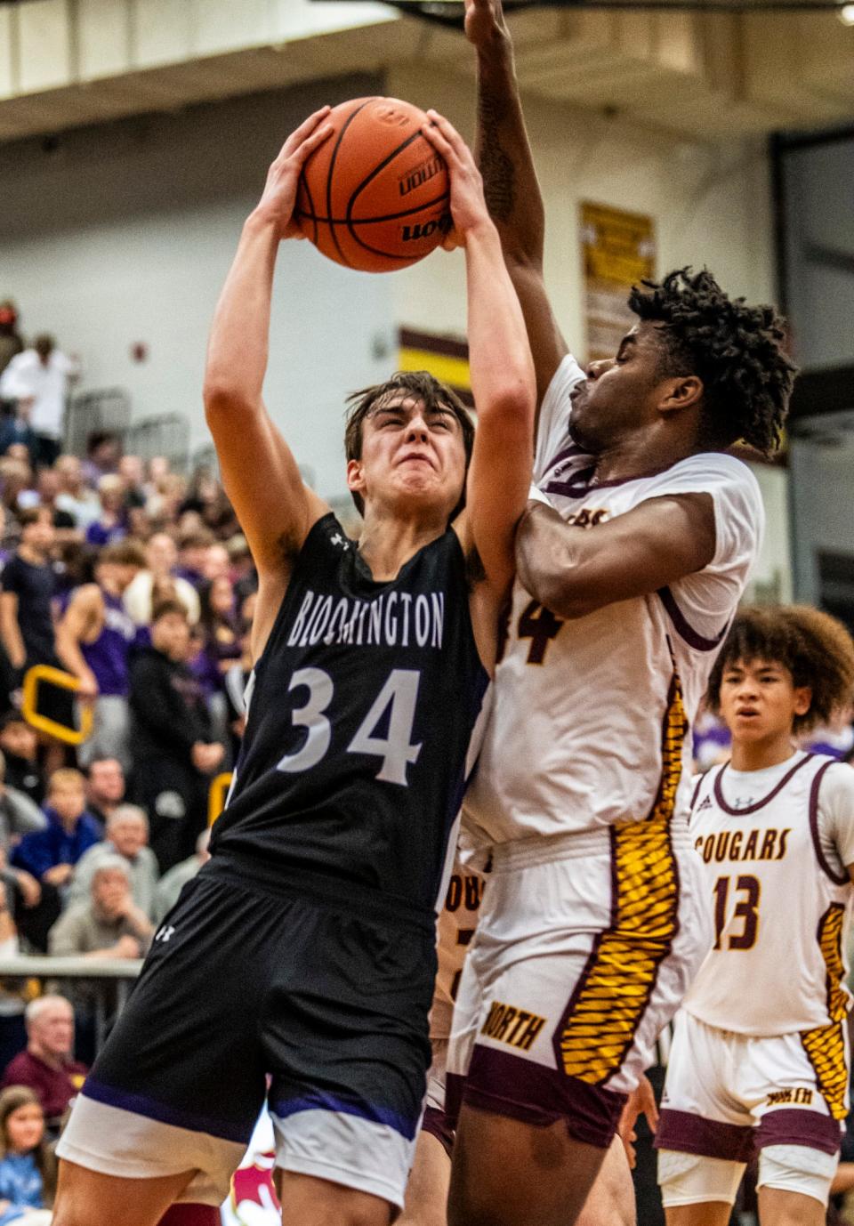 South's Vincent Moutardier (34) shoots over North's Nehemiah Dangerfield (44) during the Bloomington North versus Bloomington South boys basketball game at Bloomington High School North on Friday, Jan. 5, 2024. North won the game 56-53.