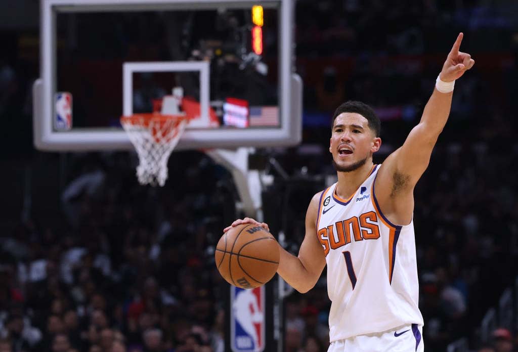  Devin Booker of the Phoenix Suns in playoff action.  