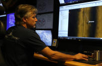 Rob Kraft, director of undersea operations at Vulcan Inc., reviews sonar scans of a warship from the World War II Battle of Midway that was found by the crew of the research vessel Petrel, Sunday, Oct. 20, 2019, off Midway Atoll in the Northwestern Hawaiian Islands. (AP Photo/Caleb Jones)