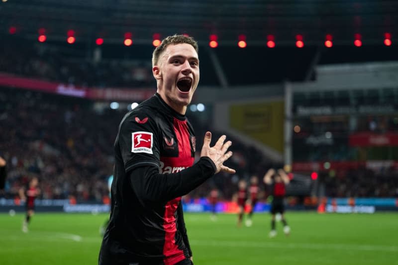 Leverkusen's Florian Wirtz celebrates scoring his side's second goal during the German Bundesliga soccer match between Bayer Leverkusen and VfL Wolfsburg at BayArena. Marius Becker/dpa