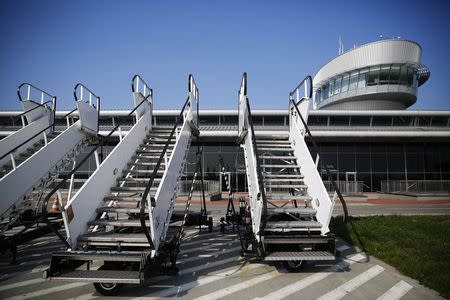 Passenger stairs are seen in front of the airport in Lodz October 10, 2014. REUTERS/Kacper Pempel