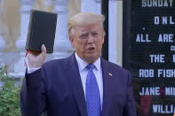 <p>The president raises a bible for an unusual photo op outside St. John's Episcopal Church in Washington, D.C., on June 1, 2020.</p> <p><a href="https://people.com/politics/donald-trump-poses-bible-church-photo-op-after-police-clear-his-path-using-tear-gas/" rel="nofollow noopener" target="_blank" data-ylk="slk:Before the image was taken at the church;elm:context_link;itc:0;sec:content-canvas" class="link ">Before the image was taken at the church</a> — located just steps from the White House — it turned out authorities had tossed flash grenades and ignited tear gas among peaceful Black Lives Matter protestors who happened to be lining the route from the president's residence to the church. </p>