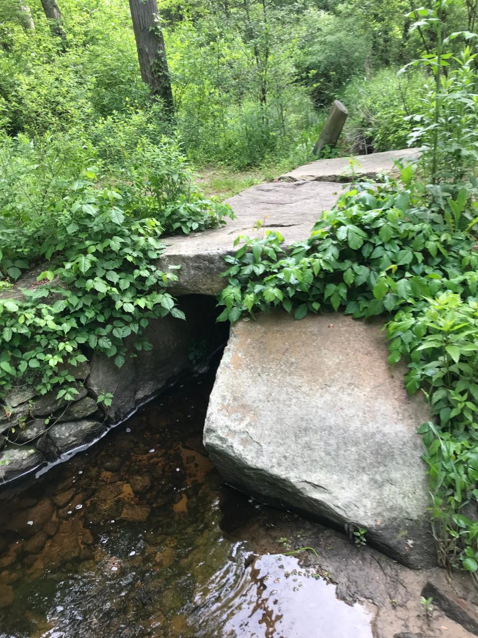 Volunteers recently rebuilt an old stone-slab bridge that allowed wagons to cross the Wine Bottle Brook.