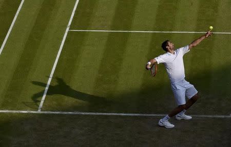 Marin Cilic of Croatia serves during his match against John Isner of the U.S.A. at the Wimbledon Tennis Championships in London, July 3, 2015. REUTERS/Toby Melville