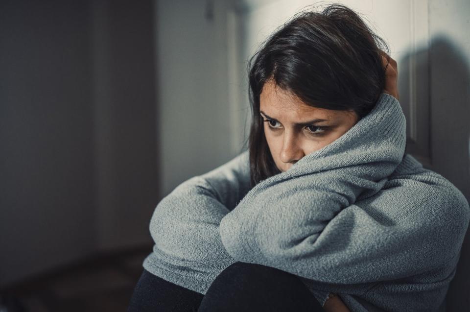 close up of young woman looking sad