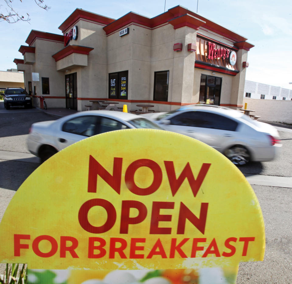 This Jan. 29, 2012 photo, shows signage promoting breakfast is at a Wendy's restaurant in Culver City, Calif. Wendy's edged out Burger King in U.S. sales volume for the first time last year since Wendy's was founded in 1969, according to a report by the food industry research firm Technomic Inc. that's set to be released next month. (AP Photo/Reed Saxon)