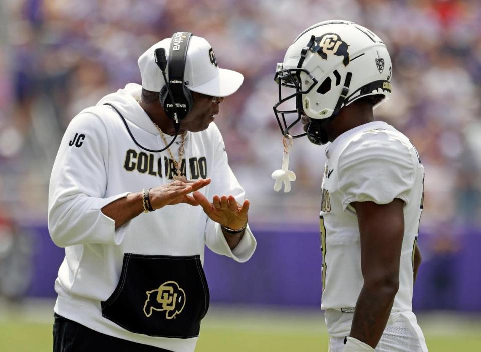 Colorado head coach Deion Sanders talks to Colorado corner back Omarion Cooper during the Buffaloes win at TCU in Fort Worth,Texas, Saturday Sept. 02, 2023. (Special to the Star-Telegram Bob Booth)
