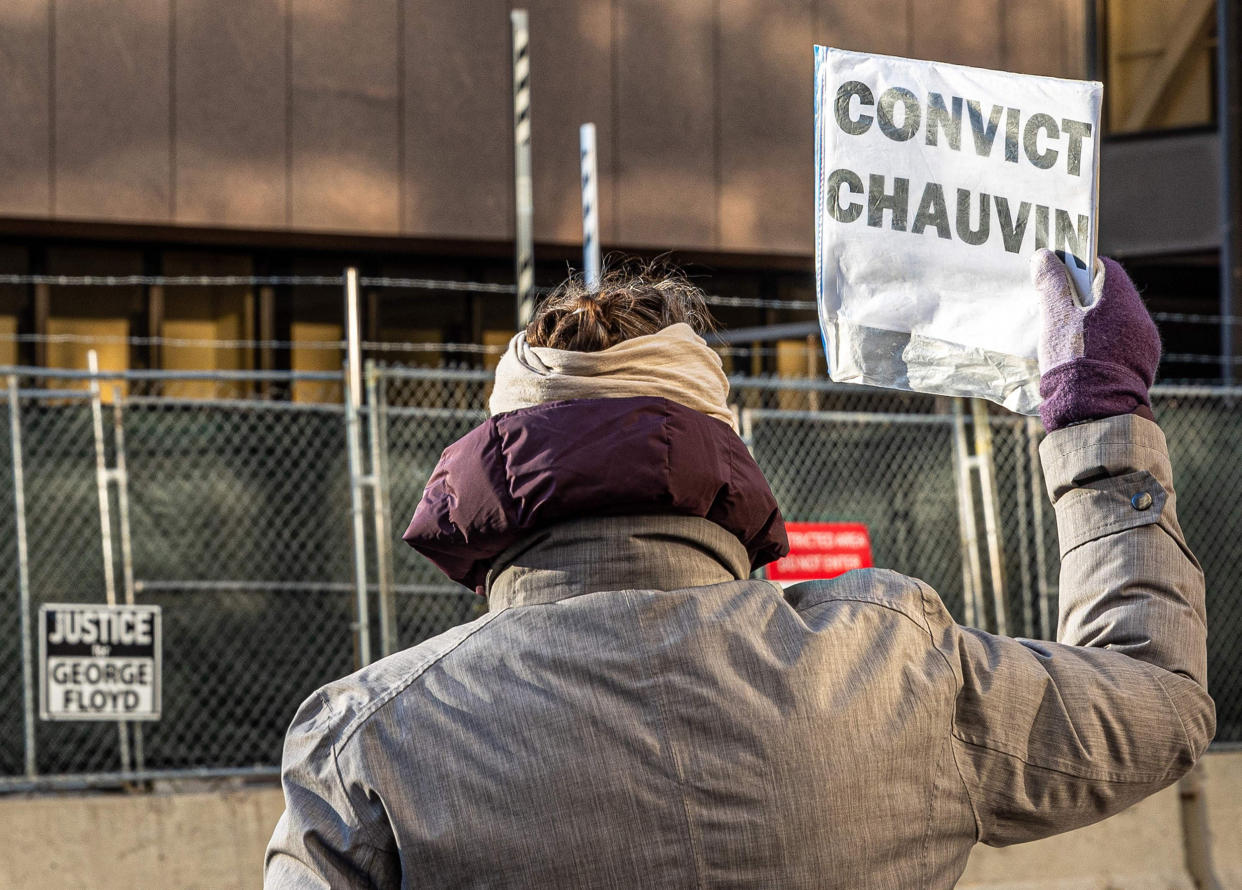 A woman protests outside the Hennepin County Government Center, where the trial of former police officer Derek Chauvin is being held, in Minneapolis on March 31, 2021. (Kerem Yucel / AFP - Getty Images)