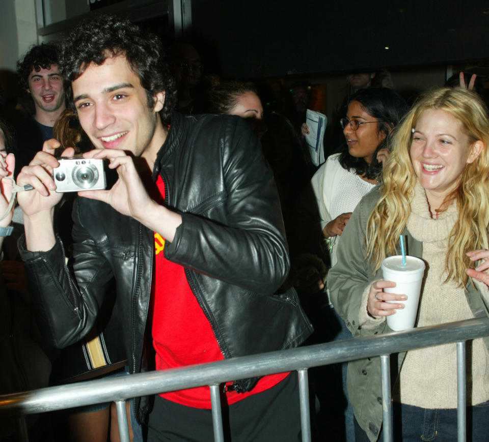 Actress Drew Barrymore and boyfriend, Strokes drummer Fabrizio Moretti,
with camera, arrive for the premiere of the new comedy film "Anger
Management" in Los Angeles April 3, 2003. Barrymore and Moretti came
through a crowd of fans to enter the premiere. The film stars Jack
Nicholson and Adam Sandler and opens April 11 in the United States.
REUTERS/Fred Prouser REUTERS

FSP