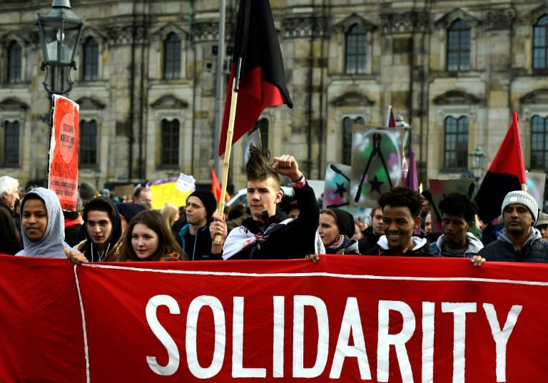 People gather in Dresden on February 6, 2016 to protest against a mass rally of the Pegida movement (Patriotic Europeans Against the Islamisation of the Occident)