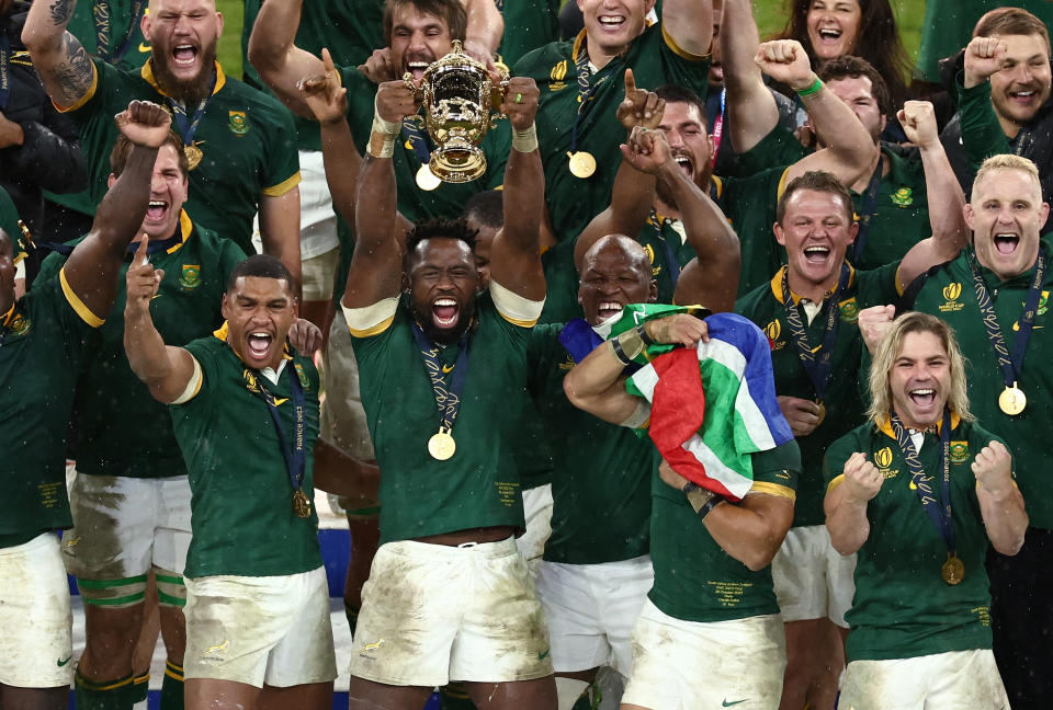 Rugby Union - Rugby World Cup 2023 - Final - New Zealand v South Africa - Stade de France, Saint-Denis, France - October 28, 2023 South Africa's Siya Kolisi lifts The Webb Ellis Cup as they celebrate winning the world cup final REUTERS/Stephanie Lecocq