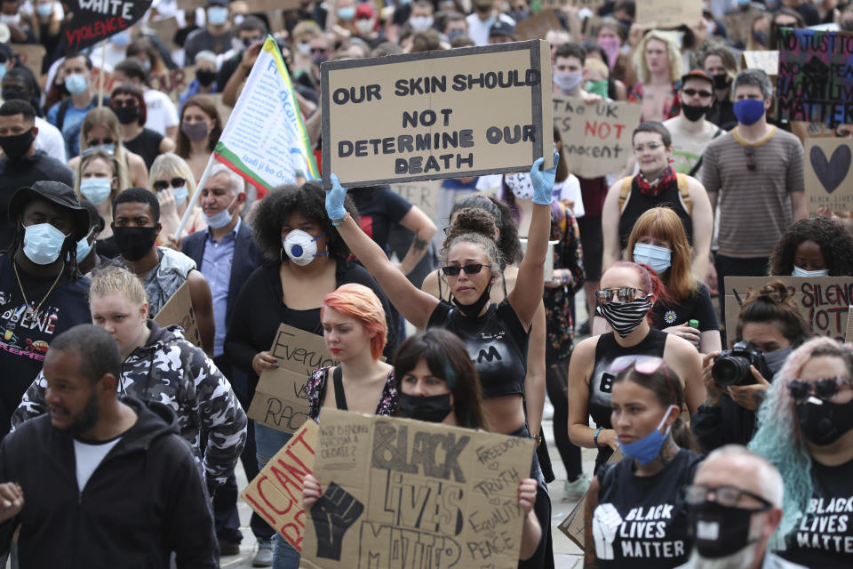 Protesters gather in Leeds, England, Sunday June 14, 2020, during a protest by Black Voices Matter. Global protests are taking place in the wake of George Floyd’s death who was killed on May 25 while in police custody in the US city of Minneapolis. (Danny Lawson/PA via AP)