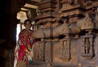 An woman worker cleans the temple precincts in Khajuraho.