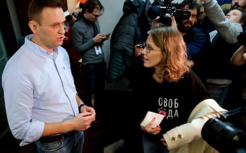 Presidential candidate Ksenia Sobchak arrives at opposition leader Alexei Navalny's office before an impromptu YouTube debate on Sunday evening - Credit: Maxim Zmeyev/AFP/Getty Images