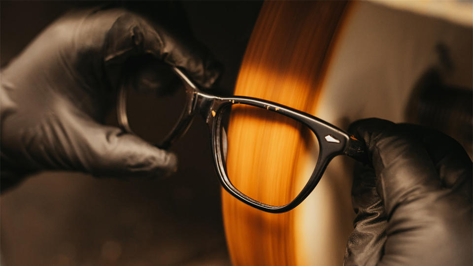 A pair of acetate Saratoga frames being polished by hand at the brand’s Chicago factory. - Credit: American Optical