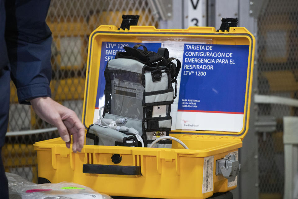 A ventilator is displayed during a news conference, Tuesday, March 24, 2020 at the New York City Emergency Management Warehouse, where 400 ventilators have arrived and will be distributed. Gov. Andrew Cuomo has sounded his most dire warning about the coronavirus pandemic on Tuesday, saying the infection rate in New York is accelerating and the state could be two to three weeks away from a crisis. (AP Photo/Mark Lennihan)