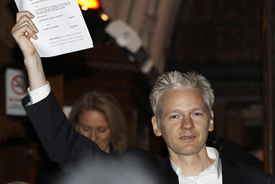 FILE - In this Dec. 16, 2010, file photo, WikiLeaks founder Julian Assange is seen outside the High Court in central London. The arrest of Assange reignites a debate with no easy answer: Is the former computer hacker and founder of WikiLeaks a journalist or not? His lawyers are quick to characterize the case against him as a threat to all journalists. (Stefan Wermuth/Pool Photo, File)