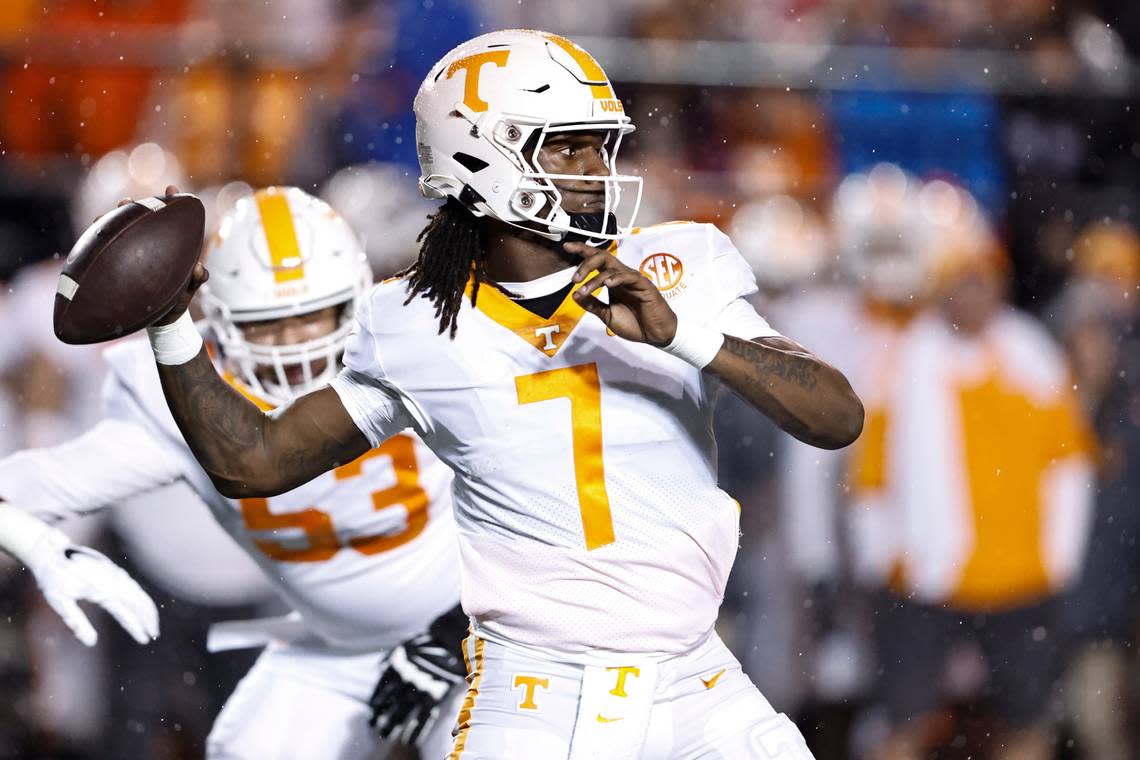 Tennessee quarterback Joe Milton III (7) throws to a receiver during the first half of the team’s NCAA college football game against Vanderbilt, Saturday, Nov. 26, 2022, in Nashville, Tenn. (AP Photo/Wade Payne)