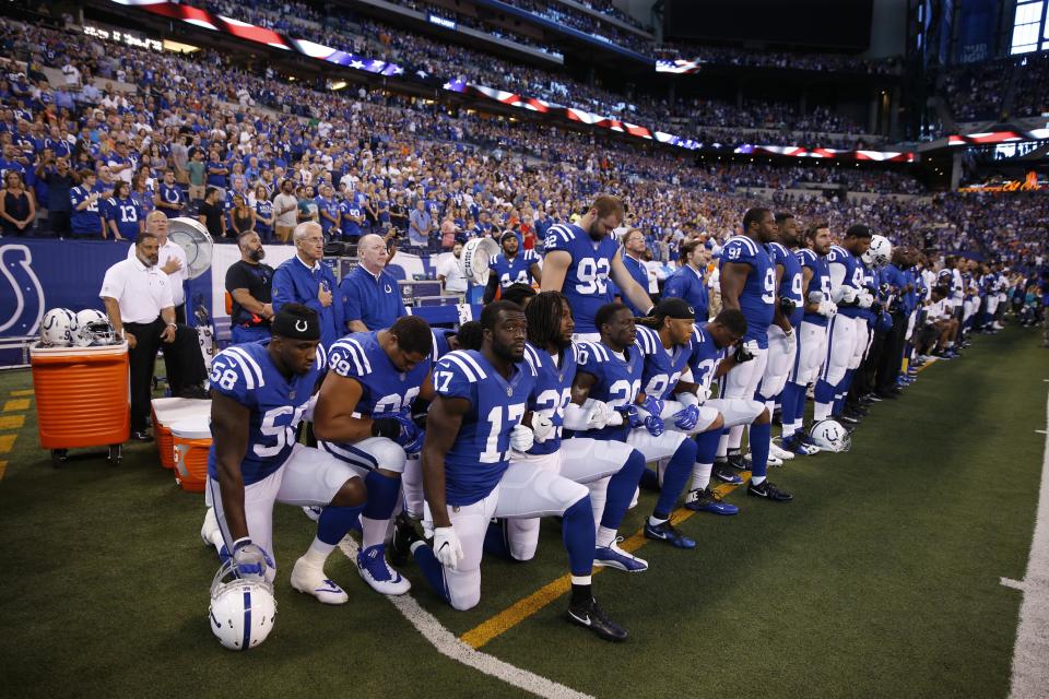 <p>Indianapolis Colts players kneel during the playing of the National Anthem before the game against the Cleveland Browns at Lucas Oil Stadium. Mandatory Credit: Brian Spurlock-USA TODAY Sports </p>