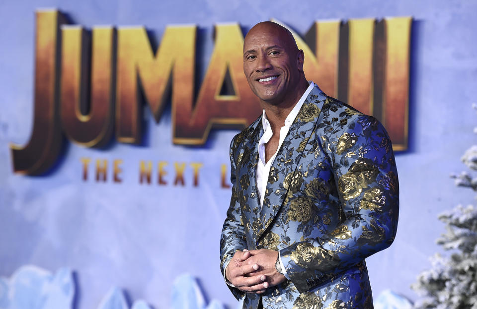 Cast member Dwayne Johnson poses for photographers at the Los Angeles premiere of "Jumanji: The Next Level" at the TCL Chinese Theatre on Monday, Dec. 9, 2019. (Photo by Jordan Strauss/Invision/AP)