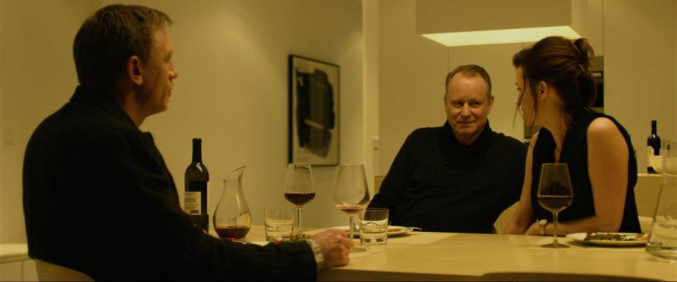 Stellan Skarsgård sitting at a table