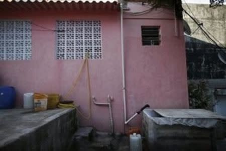 A view of a rainwater installation to collect water (in a box, R), for use in the bathroom and to clean the house floor, is pictured in Brasilandia slum, in Sao Paulo, Brazil, February 11, 2015. REUTERS/Nacho Doce