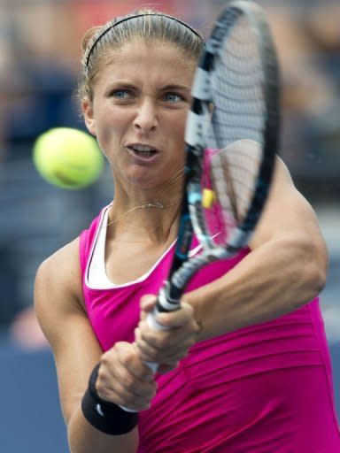 Sara Errani of Italy hits a return to Angelique Kerber of Germany during their women's singles match at the 2012 US Open tennis tournament in New York. Errani won 7-6 (7/5), 6-3