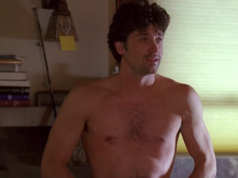 Patrick Dempsey in Greys Anatomy as Derek, sitting on a bed shirtless