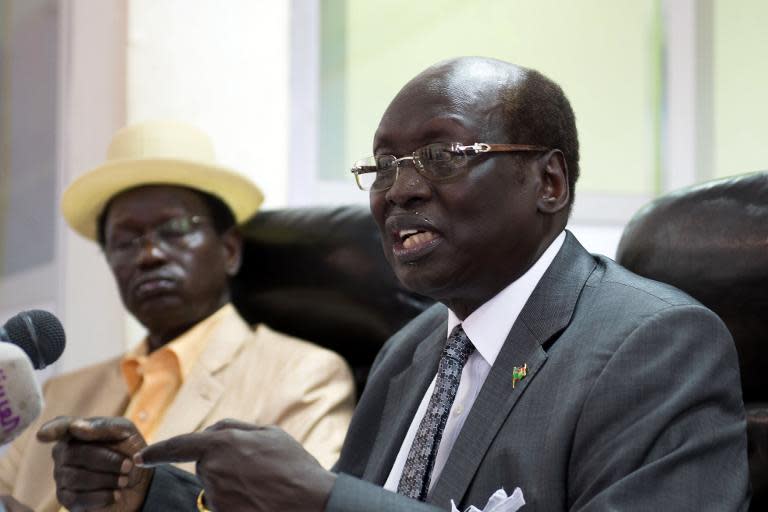 South Sudan's Foreign Minister Barnaba Marial Benjamin (right) speaks during a press conference with Interior minister Aleu Ayienyi Aleu in Juba, on April 18, 2014