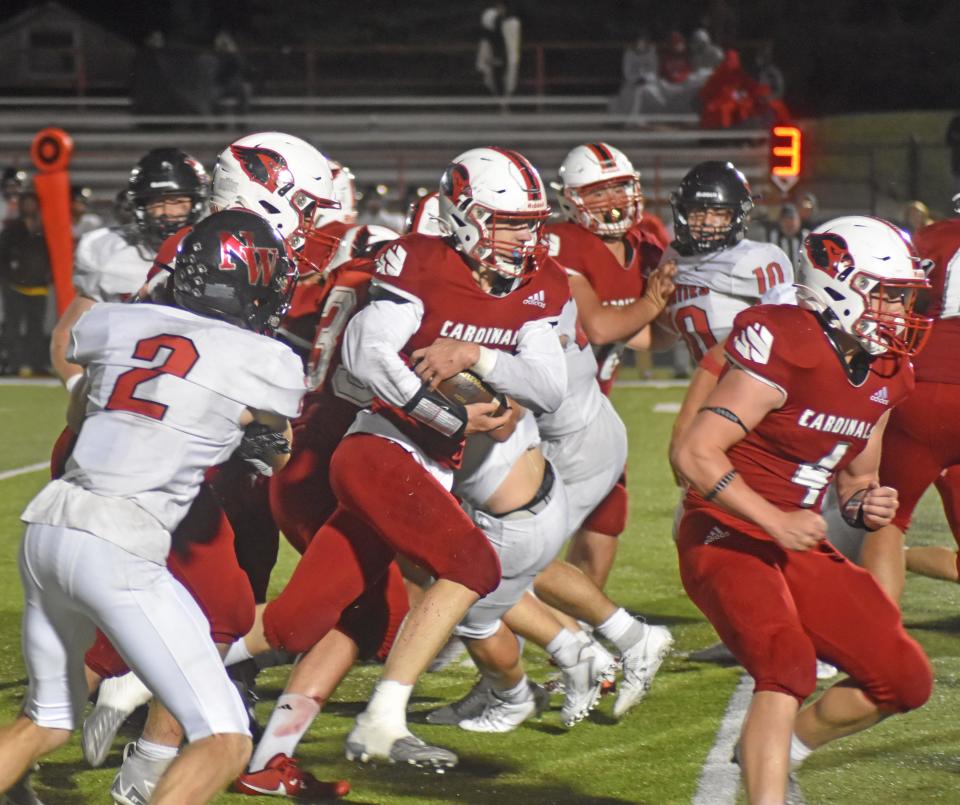 Coldwater quarterback Zach Coffing picks his way through the Northwest defense on his way to the Cardinals' only touchdown of the day