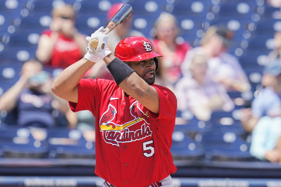 St. Louis Cardinals' Albert Pujols (5) bats in the first inning of a spring training baseball game against the Washington Nationals, Wednesday, March 30, 2022, in West Palm Beach, Fla. (AP Photo/Sue Ogrocki)