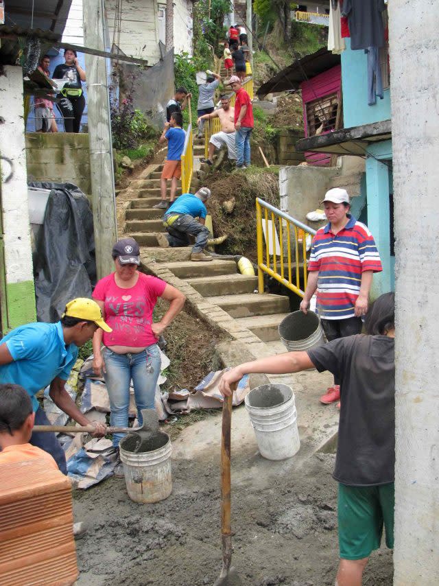 Community members putting drainage mitigation works in place in Colombia (Heriot-Watt University/PA)