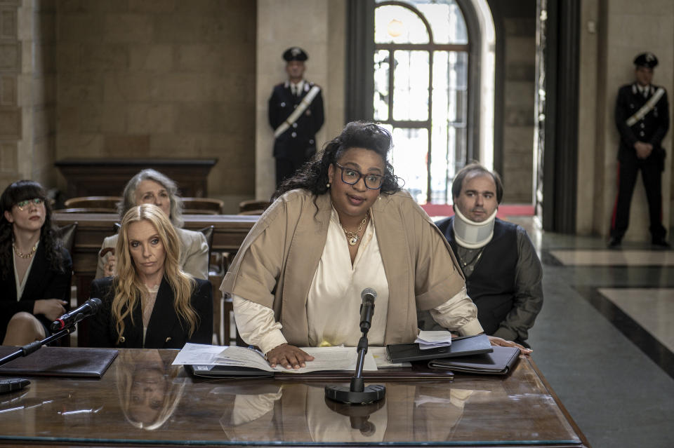 This image released by Bleecker Street shows Toni Collette, left, Sophia Nomvete and Alfonso Perugini, seated right, in a scene from "Mafia Mamma." (Bleecker Street via AP)