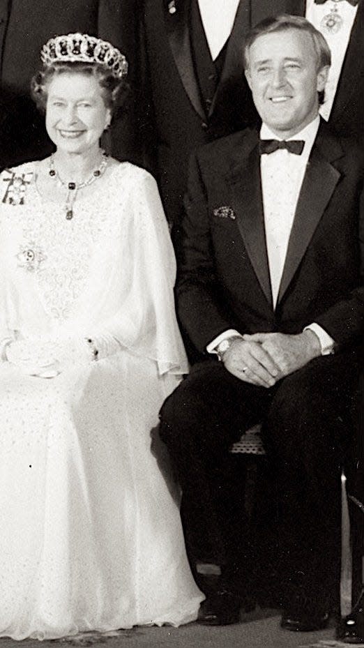 Then-Canadian Prime Minister Brian Mulroney sits with Queen Elizabeth II in this undated photo.