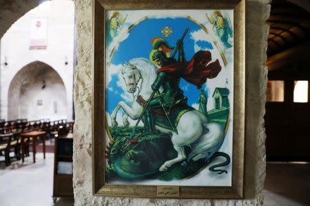 An artifact carrying the image of Third century martyr St. George, the patron saint of England, is seen in the Anglican St. George's Cathedral in Jerusalem, June 13, 2018. Picture taken June 13, 2018. REUTERS/Ammar Awad