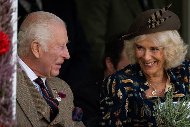 Camilla smiles at Charles as they attend the Braemar Gathering