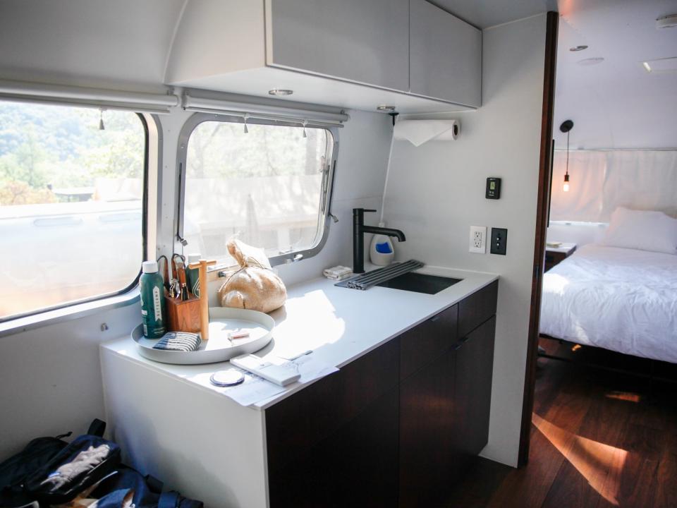 a kitchen with a sink under cabinets