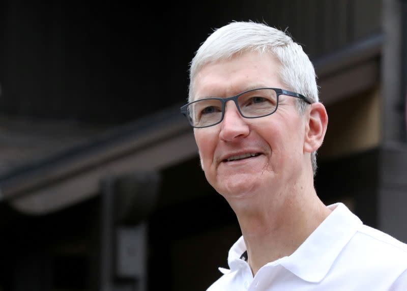 FILE PHOTO: Tim Cook, CEO of Apple, attends the annual Allen and Co. Sun Valley media conference in Sun Valley, Idaho