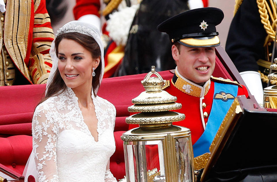 kate middleton wears cartier tiara, LONDON, ENGLAND - APRIL 29:  TRH Prince William, Duke of Cambridge and Catherine, Duchess of Cambridge smile at the cheering crowds as they make the journey by carriage procession to Buckingham Palace following their marriage at Westminster Abbey on April 29, 2011 in London, England. The marriage of the second in line to the British throne was led by the Archbishop of Canterbury and was attended by 1900 guests, including foreign Royal family members and heads of state. Thousands of well-wishers from around the world have also flocked to London to witness the spectacle and pageantry of the Royal Wedding.  (Photo by Christopher Furlong/Getty Images)