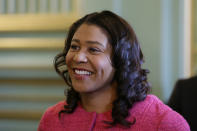 FILE - In this Nov. 1, 2019, file photo, San Francisco Mayor London Breed waits to speak at a luncheon in San Francisco. San Francisco will allow outdoor dining and indoor shopping, religious services and even sporting events without spectators June 15 with barbershops and hair salons to open for service in mid July, the city's mayor announced Thursday, May 28, 2020. Mayor London Breed said nail salons, tattoo parlors, gyms and bars are scheduled to open in mid-August and in phases, but all dates are tentative and dependent on the city's coronavirus numbers staying stable or declining. (AP Photo/Eric Risberg, File)