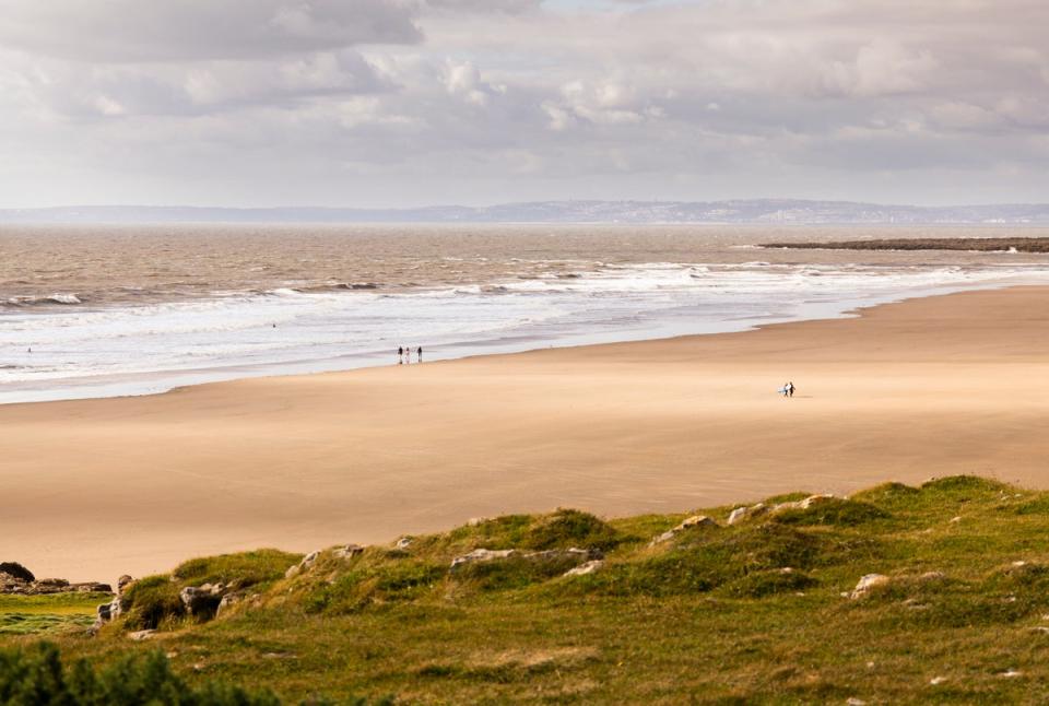 The surfing peaks off of Rest Bay are great but it’s also a brilliant stretch of beach for walking (Getty Images/iStockphoto)