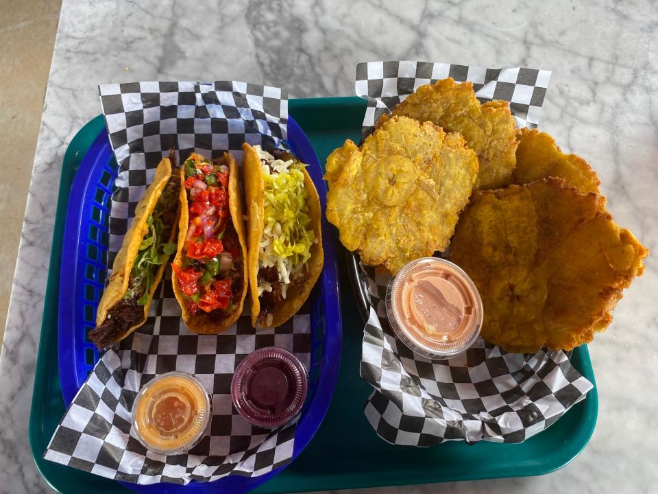 A trio of tacos and tostones from The Fried Taco.