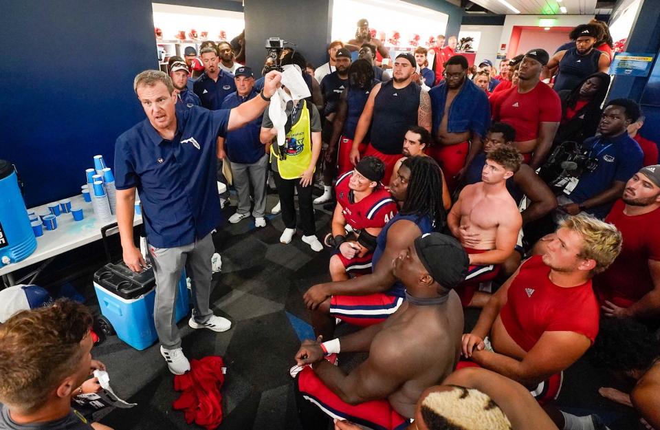 Florida Atlantic head coach Tom Herman speaks with his team after a 42-20 victory over Monmouth at FAU Stadium on Saturday, September 2, 2023, in Boca Raton, FL.