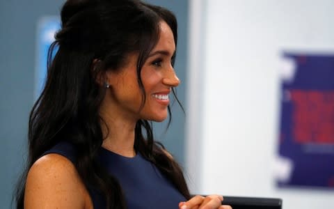 The Duchess of Sussex reacts during her visit to Macarthur Girls High School - Credit: Phil Noble/Getty