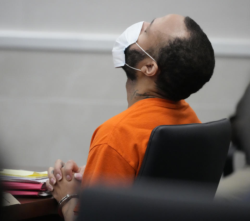 Darrell Brooks listens to victim statements during his sentencing in a Waukesha County Circuit Court in Waukesha, Wis., on Tuesday, Nov. 15, 2022. Dozens of people are expected to speak at the sentencing proceedings for Brooks, who was convicted of killing six people and injuring dozens more when he drove his SUV through a Christmas parade in Waukesha last year. (Mike De Sisti/Milwaukee Journal-Sentinel via AP, Pool)