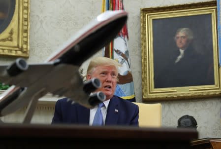 U.S. President Trump speaks to reporters while meeting with Pakistan’s Prime Minister Khan in the Oval Office of the White House in Washington