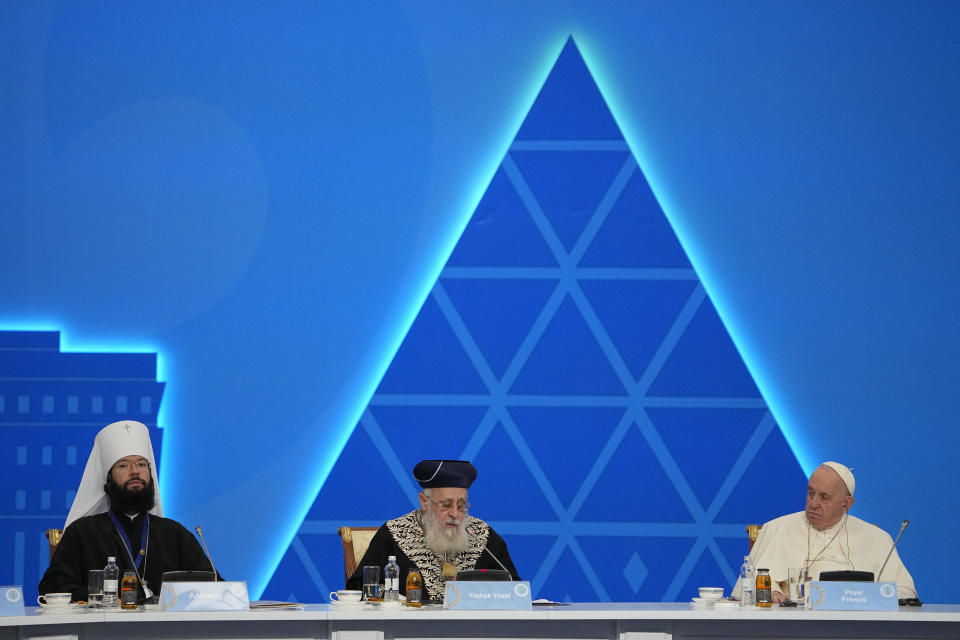 Pope Francis, right, and Metropolitan Anthony, in charge of foreign relations for the Russian Orthodox Church, left, listen to Sephardi Chief Rabbi of Israel, Yitzhak Yosef speaking at the '7th Congress of Leaders of World and Traditional Religions, in Nur-Sultan, Kazakhstan, Wednesday, Sep. 14, 2022. Pope Francis is on the second day of his three-day trip to Kazakhstan. (AP Photo/Alexander Zemlianichenko)