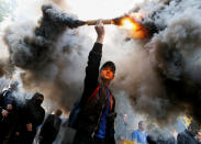 <p>Members of the Ukrainian national guard “Azov” regiment and activists of the Azov civil corp take part in a protest against local elections in pro-Russian rebel-held areas of eastern Ukraine under the Minsk peace agreement, in Kiev, Ukraine, May 20, 2016. (Gleb Garanich/REUTERS) </p>