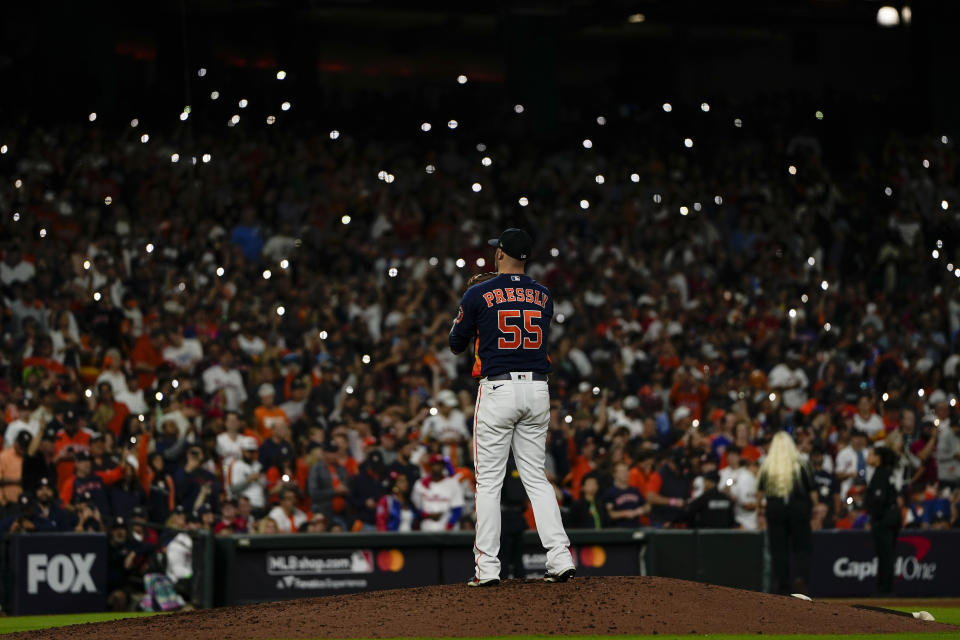 Houston Astros relief pitcher Ryan Pressly works during the ninth inning in Game 2 of baseball's World Series between the Houston Astros and the Philadelphia Phillies on Saturday, Oct. 29, 2022, in Houston. (AP Photo/David J. Phillip)